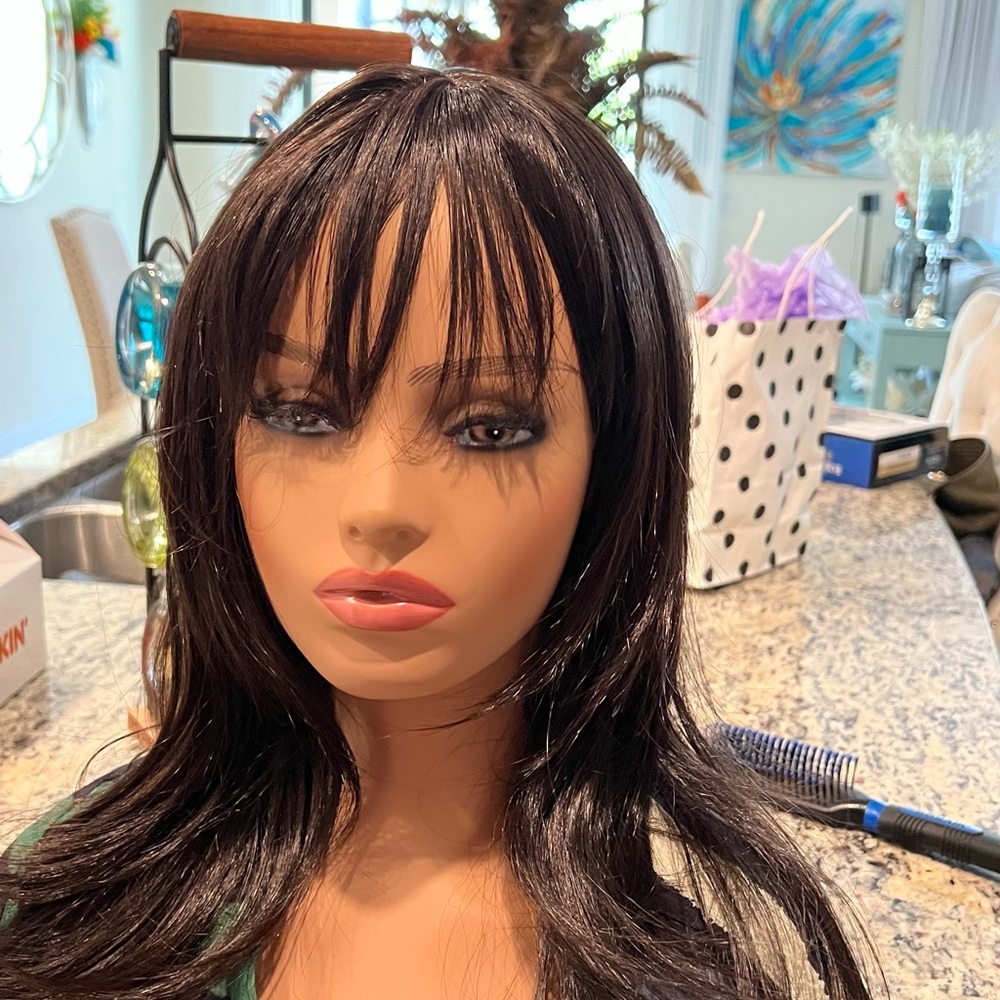 Cute synthetic wig unit with bangs.